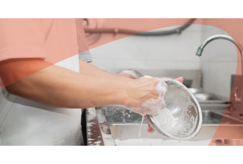 man washing dishes