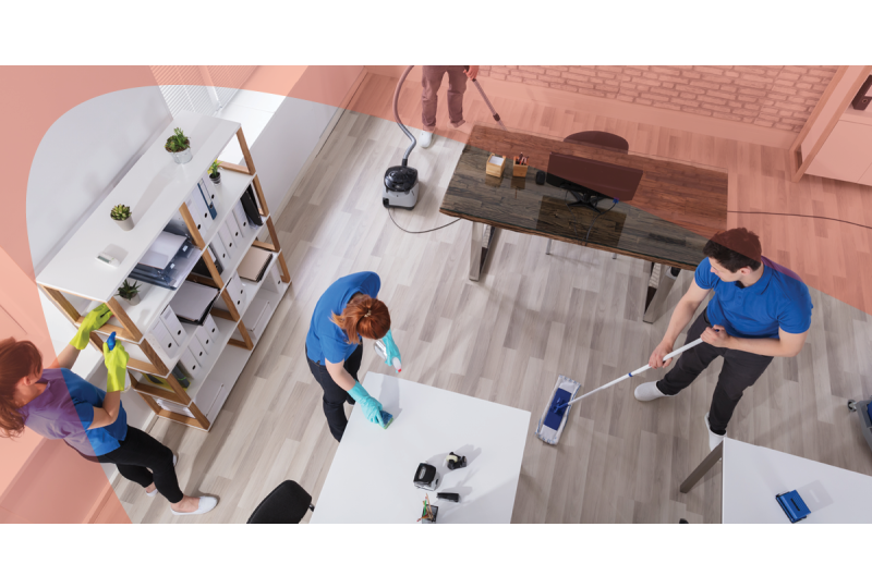 Janitorial team cleaning empty office