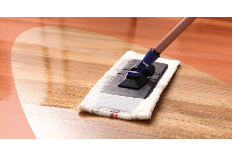 Cleaning laminate wood floor with microfiber mop