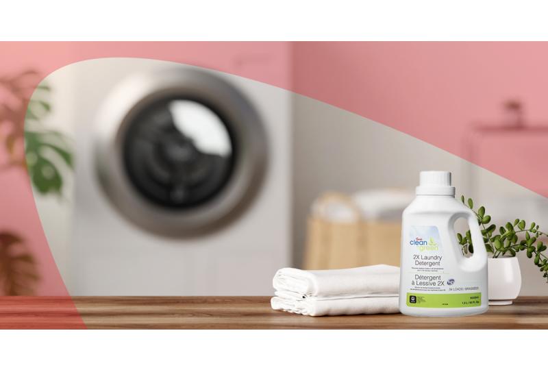 Clean folded laundry next to sustainable detergent